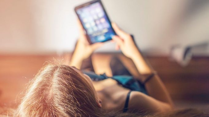 Young woman surfing the net with digital tablet